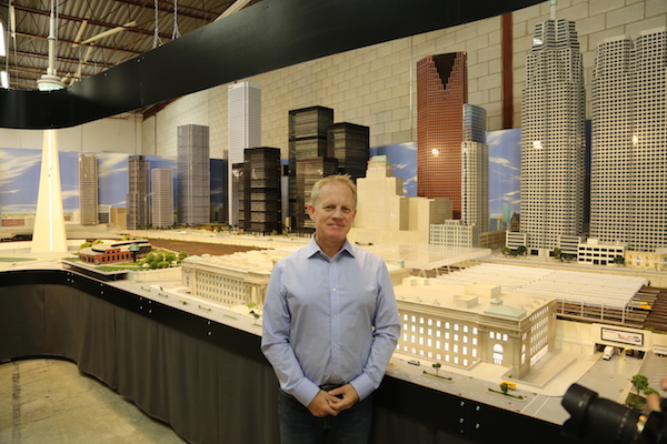U of T Engineering alumnus David MacLean stands in front of Our Home & Miniature Land’s Toronto exhibit. “It’s like watching something I dreamed up come to fruition,” he said. (Photo: David MacLean)