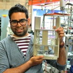 Post-doctoral fellow Aaron Persad (MIE) shows his experiment that aims to solve the longstanding mystery of how water behaves in space. (credit: Aaron Persaud).