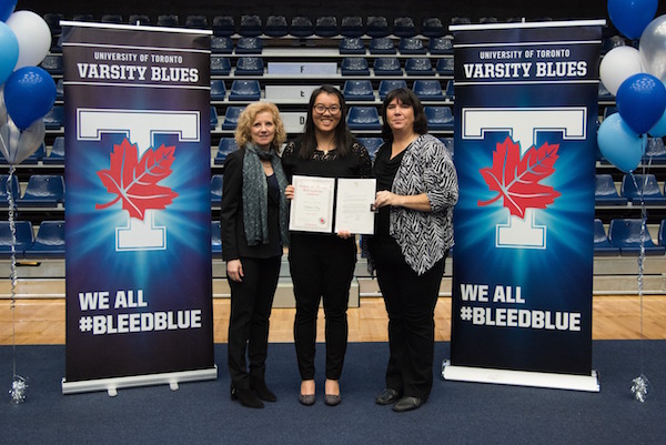 Nathalin Moy receives her award