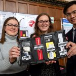 From left: Jacqueline Fleisig, Cassandra Chanen and Zhengbang Zhou (all Year 1 EngSci) show their redesigned naloxone kit at the 2018 Praxis Showcase event, April 13, 2018 in the Great Hall of Hart House. (Credit: Laura Pedersen).