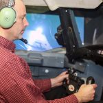 Professor Peter Grant (UTIAS) practices responding to an aerodynamic stall in a flight simulator at the University of Toronto Institute for Aerospace Studies. (Credit: Marit Mitchell).