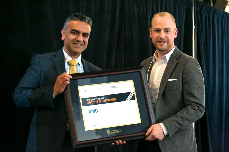 Roger Francis, Director, Engineering Career Centre, presents an Employer of Distinction Award to a representative of AMD. (Photo: Dhuoi Chang)