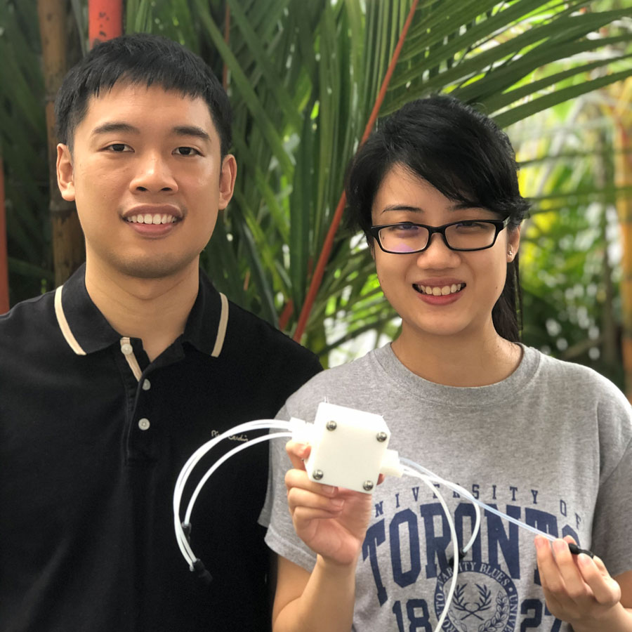 Yanwei Lum (left) and Wan Ru Leow (right) with a prototype electrolyzer. Their low-emission method for converting ethylene to ethylene oxide is described in a new paper in Science. (Photo courtesy Wan Ru Leow) 