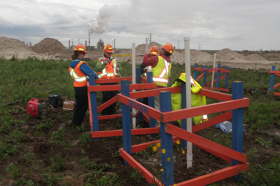 Professor Warren and her collaborators conducting environmental sampling at the Base Mine Lake site. (Photo courtesy Lesley Warren)