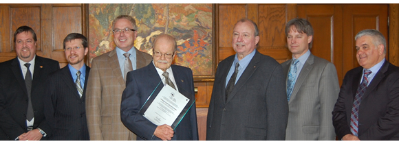 Professor Frank Hooper (4th from left) receives an award from the Canadian GeoExchange Coalition for his pioneering research on ground source heat pump and cooling technology at the University of Toronto Faculty Club, May 4, 2011. (Photo courtesy U of T Department of Mechanical and Industrial Engineering)