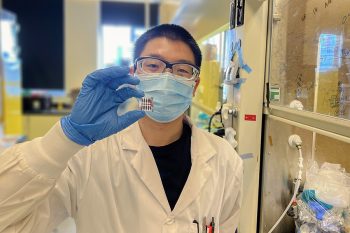 Postdoctoral fellow Dr. Hao Chen shows off a prototype inverted perovskite solar cell created in the lab of Professor Ted Sargent (ECE). The team leveraged quantum mechanics to improve both the stability and efficiency of this alternative solar technology. (Photo: Bin Chen)