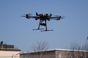 Liu and his team develop computer algorithms that enable unmanned aerial vehicles (UAVs) like this octocopter — a UAV with eight sets of blades — respond to sensor input and fly in carefully controlled ways (Photo: Hugh Liu).