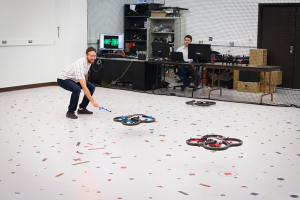 Graduate students Mario Vukosavljev and Thomas Bamford experiment with visual tracking in drones in Professor Anglea Schoellig’s lab at the University of Toronto Institute for Aerospace Studies (UTIAS). (Photo: Yani Macute)