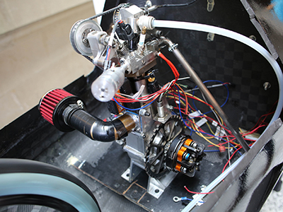 The ultra-efficient 45 cc rewired-engine, pictured here, is one of many upgrades the U of T Engineering student team made to their new vehicle. (Photo: Roberta Baker).