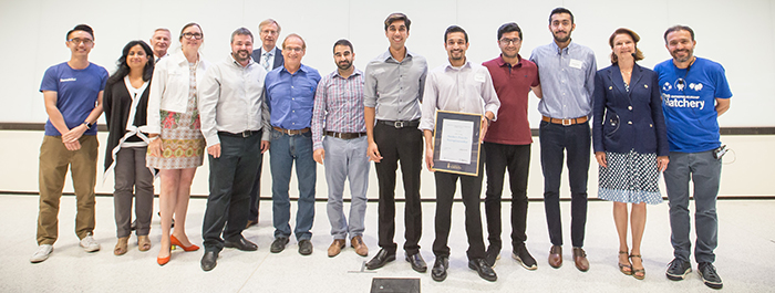 Team Grid, alongside Demo Day judges, Dean Cristina Amon and Joseph Orozco.