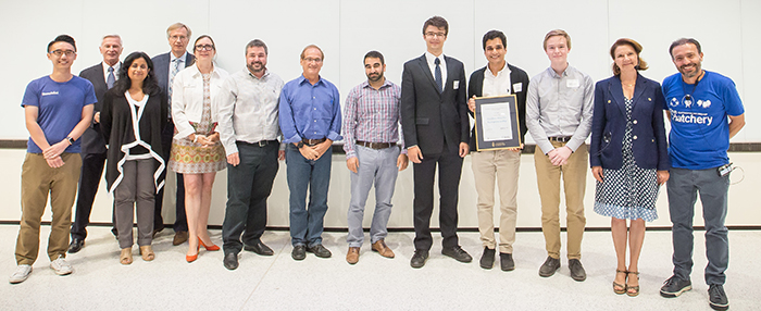 Team Knowtworthy alongside Demo Day judges, Dean Cristina Amon and Joseph Orozco. (Credit: Ben Ouyang)