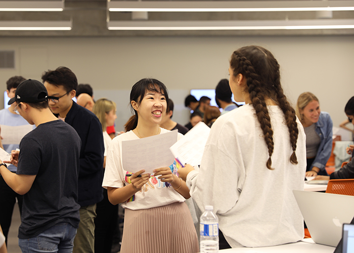 Engineering Business minor students taking part in Personality bingo, which encourages students to get to know each other through asking questions about behaviours that may be associated with particular personality characteristics. (Credit: Liz Do)