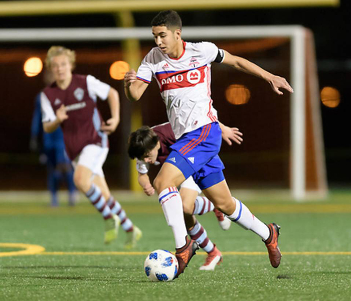 Mehdi Essoussi (ECE Year 1) shakes off a defender in a game against Colorado Rapids in Houston. (Courtesy: Mehdi Essoussi)