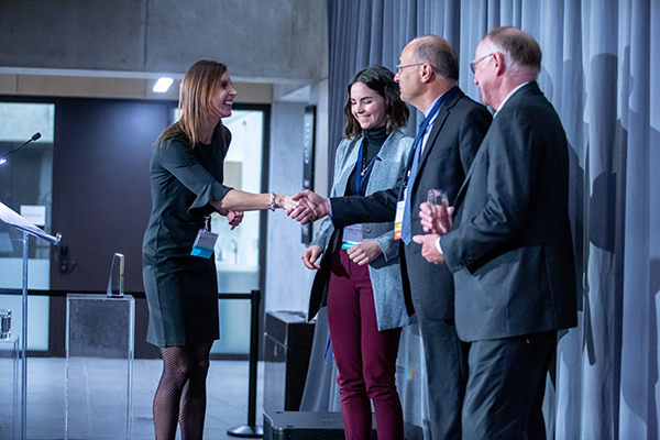 From left: Dr. Allison Brown presents EllisDon Sustainability Coordinator Kaitlyn Tyschenko, Senior Vice President of Construction Sciences George Charitou and Senior Vice President of Aligned Chris Andrews with the Corporate Academic Citizen Award. (Photo: Paul Terefenko)