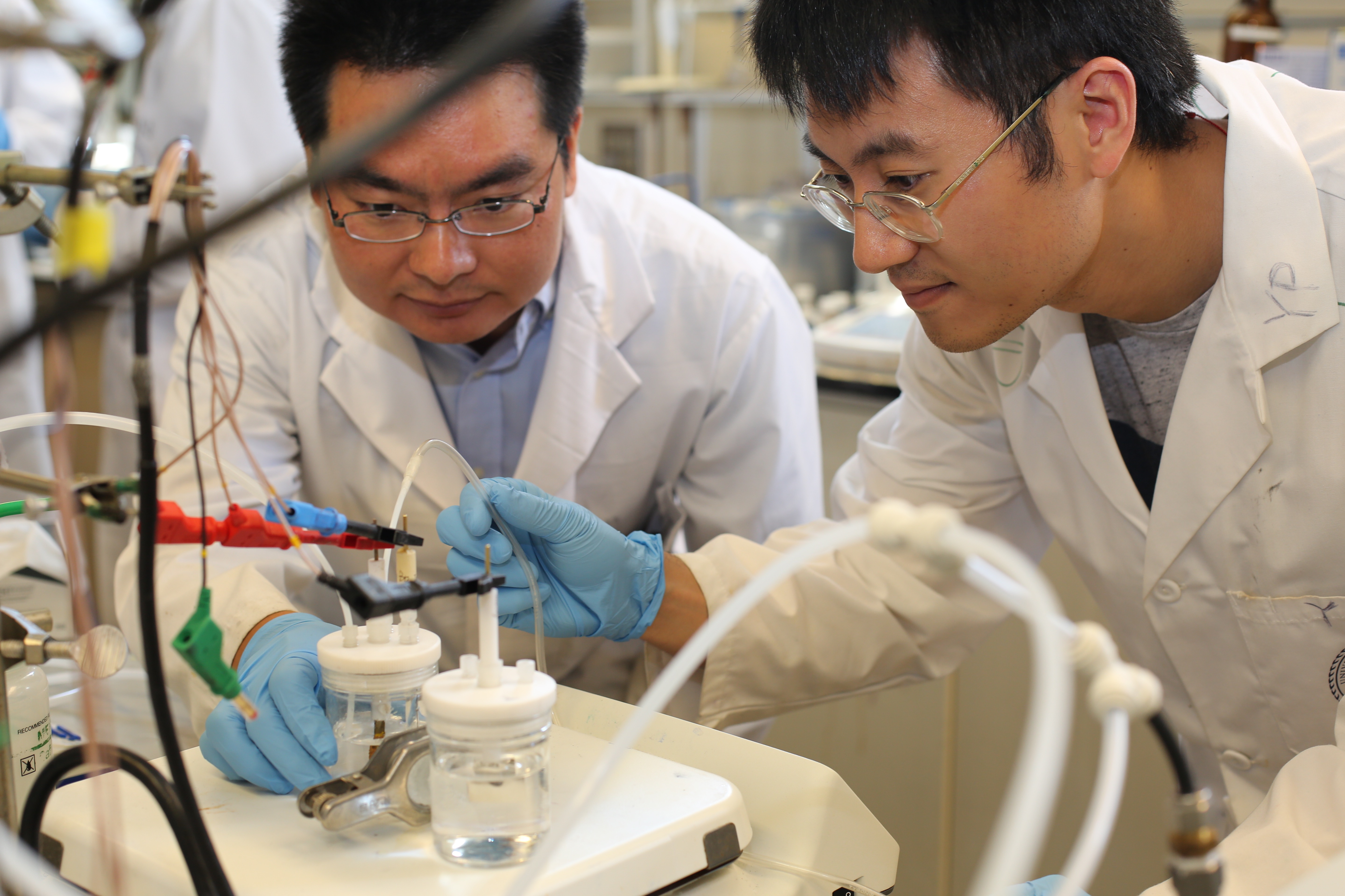 U of T Engineering researchers Min Liu (left), Yuanjie Pang and their team designed a way to efficiently reduce climate-warming carbon dioxide into carbon monoxide, a useful chemical building block for fuels such as methanol, ethanol and diesel. (photo: Marit Mitchell).