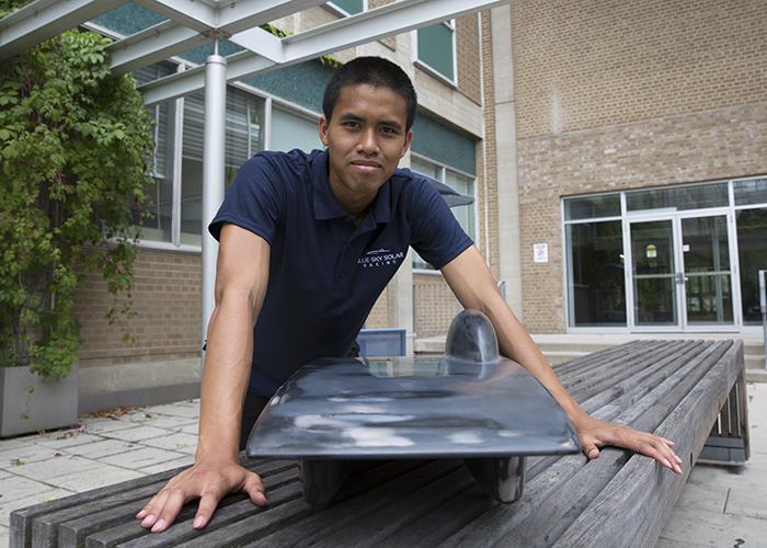 Blue Sky Solar Racing's aerodynamic lead, Khanin Thongmongkol (Year 4 EngSci) with a 3D model of Polaris. The team conducted wind-tunnel tests of 3D-printed models of two retired vehicle designs, Horizon and Polaris, to help inform the design of their 10th generation vehicle.