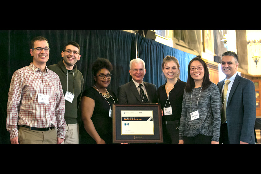 Representatives of IBM receive the "Employer of Distinction" award from Tom Coyle, Vice-Dean, Undergraduate (fourth from left) and Roger Francis, Director, Engineering Career Centre (far right) at the inaugural PEY Co-op Recognition Reception. (Photo: Dhuoi Chang)