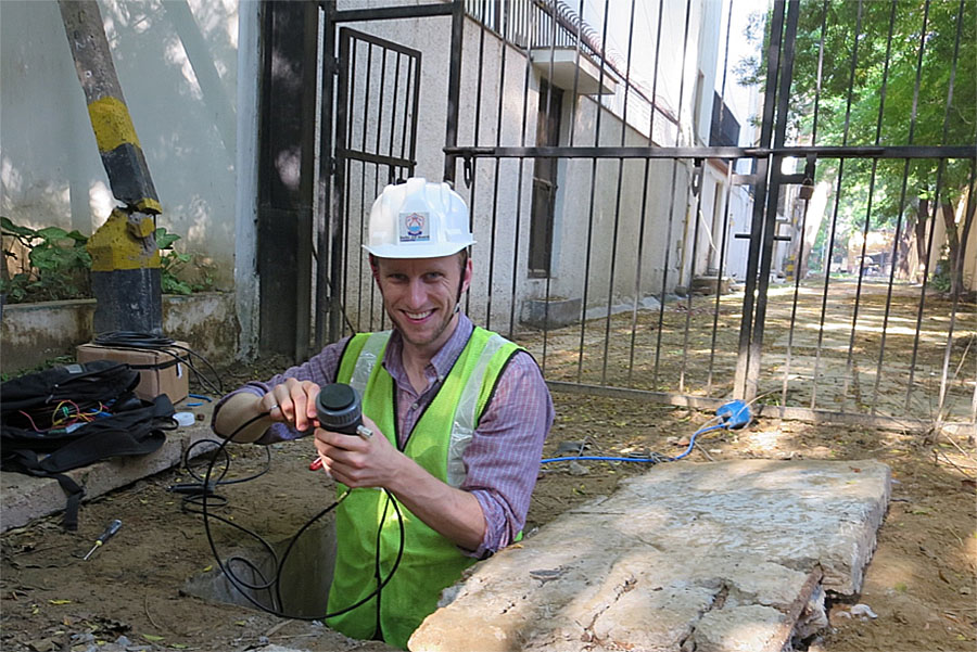 Professor David Taylor checking on his pressure, flow, and turbidity sensors in a valve chamber in Delhi, India. (Photo courtesy David Taylor)