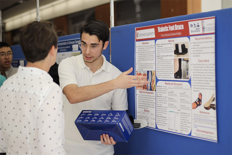 A student from George Harvey Collegiate Institute presents a diabetic foot brace designed as part of the Discovery outreach program in June 2019. Amid the COVID-19 pandemic, this year’s program successfully pivoted online. (Photo: Bill Dai)