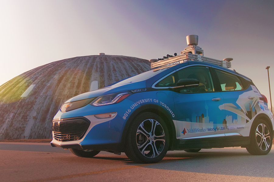 Zeus, a self-driving electric car created by a team of students from U of T Engineering, parked outside the MarsDome at the University of Toronto Institute for Aerospace Studies. The team has placed first in the intercollegiate Autodrive Challenge the last four years in a row. (Photo: Chude Qian)