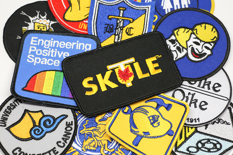 Badges relating to the activities for the U of T Engineering Society and its affiliated clubs. A new bursary from Skule™ Mental Wellness will expand access to mental health and wellness supports for students. (Photo: Roberta Baker)
