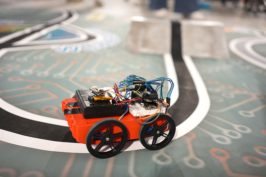 A robot follows the course track during the race on the workshop’s final day. (Photo: Matthew Tierney)