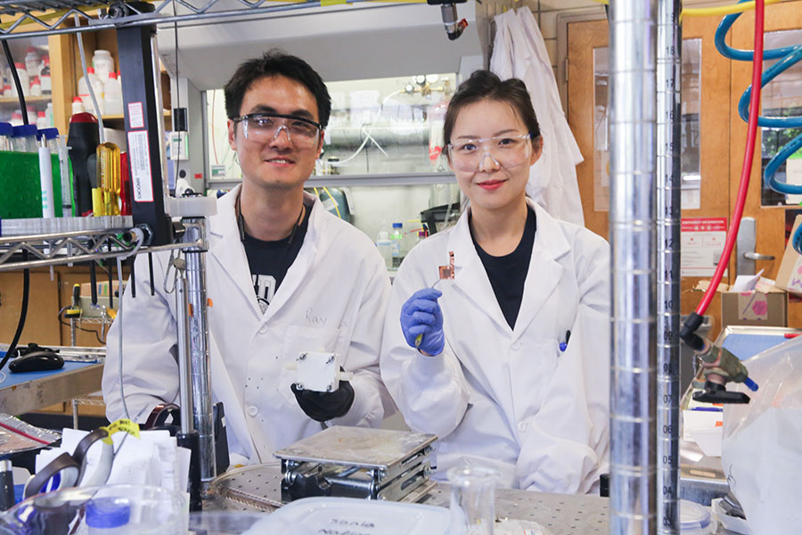 Students demonstrate a new catalyst in the lab