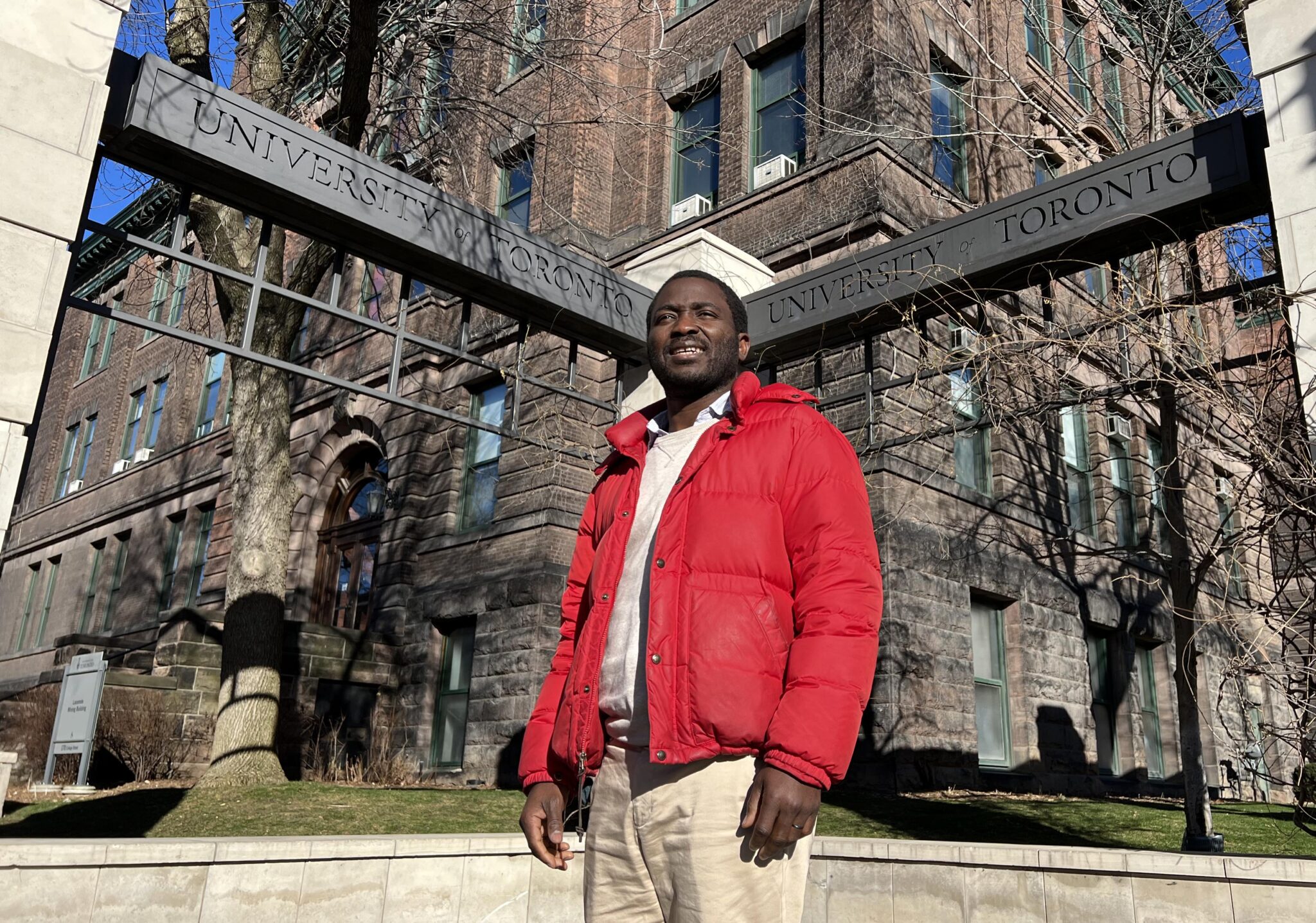 Professor Hamed Ibrahim (CivMin) poses for a photo by the main University of Toronto gates. (Photo: Phill Snel)
