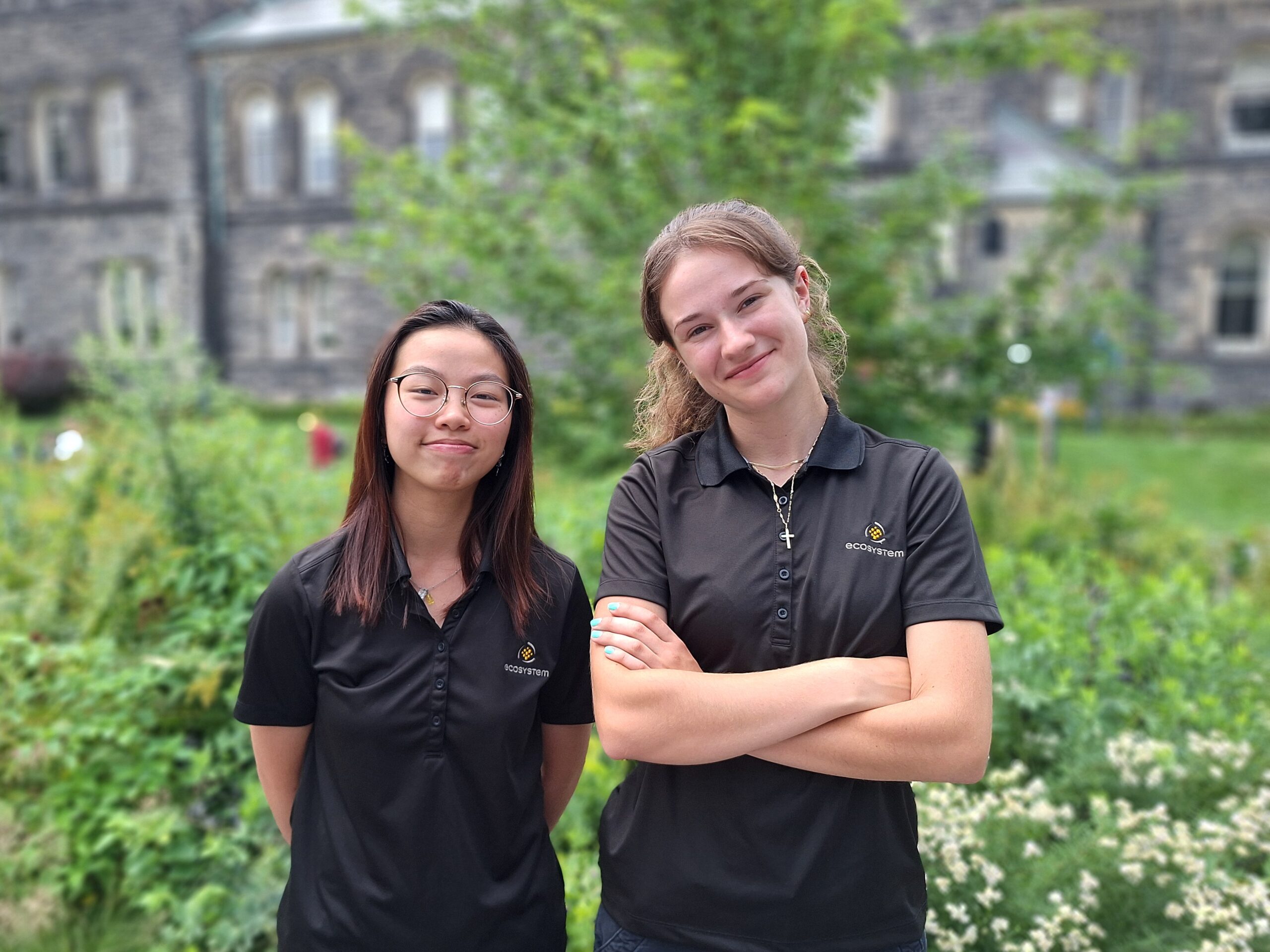 Image Katie Hung and Anastasia Polulyakhova in front of building on campus.