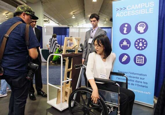 Angela Chen demonstrates The Swivet at the Innovative Designs for Accessibility (IDeA)