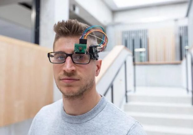 2023-05-05 Brokoslaw Laschowski_Polina Teif-6-crop (1) Professor Brokoslaw Laschowski wears a prototype of his lab’s AI-powered smart glasses (Photo: Polina Teif)