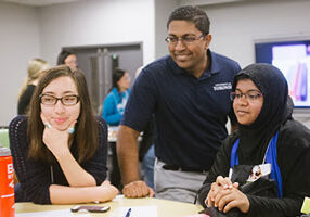 Professor Chirag Variawa (centre) teaches both graduate and undergraduate students and is encouraging them to address educational challenges through engineering design. (Photo: Alan Yusheng Wu)