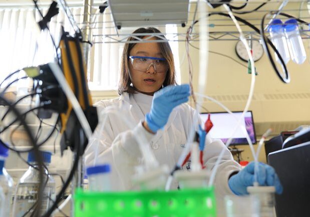 PhD candidate Geonhui Lee works on an electrolyzer in the lab of Professor Ted Sargent (ECE). She is the lead author on a new paper in Nature Energy that outlines an electrochemical method for converting captured carbon into useful products, from fuels to plastics. (Photo: Marit Mitchell)