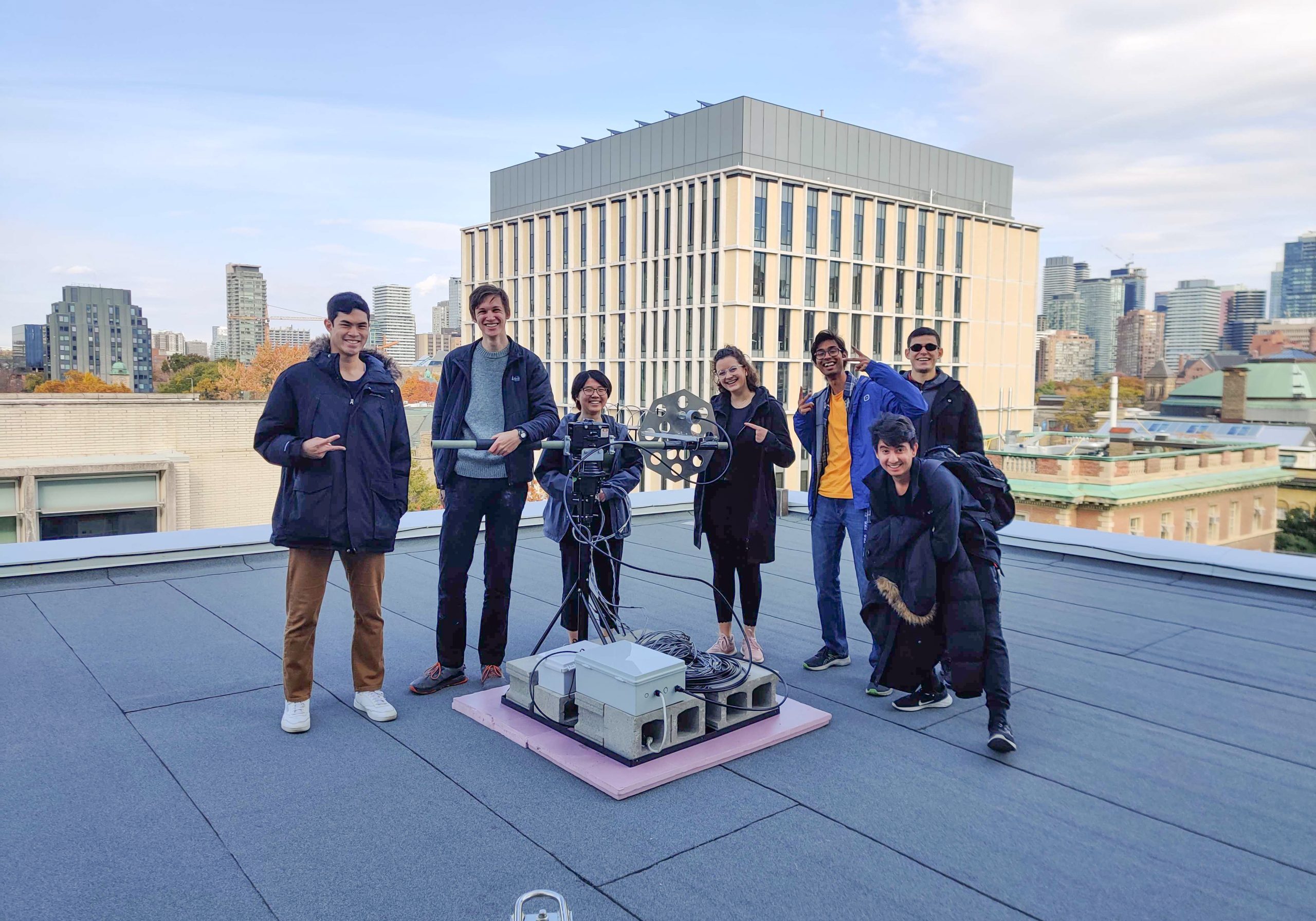 Members of the UTAT Space Systems division gather on the sixth-floor roof of the Bahen Centre with the fully assembled ground station.
